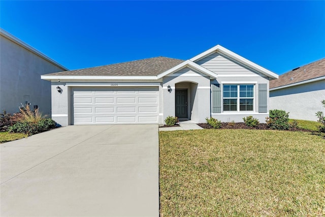 ranch-style house featuring a garage and a front yard