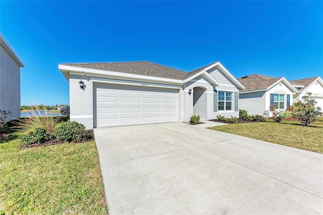 ranch-style house with a garage and a front lawn