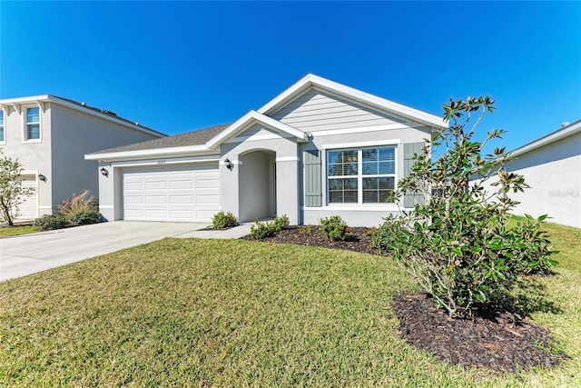 single story home with a garage and a front lawn