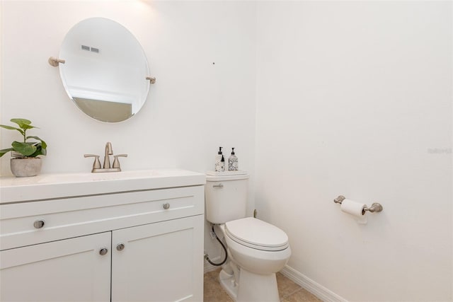 bathroom with baseboards, visible vents, toilet, tile patterned floors, and vanity