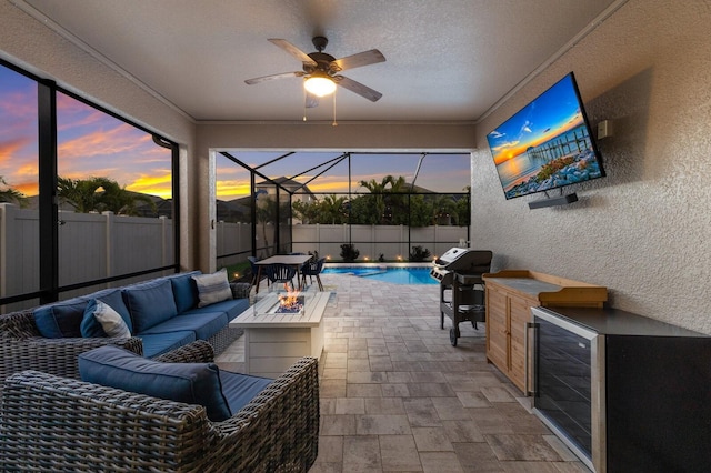 view of patio / terrace featuring area for grilling, outdoor lounge area, ceiling fan, a grill, and a fenced in pool