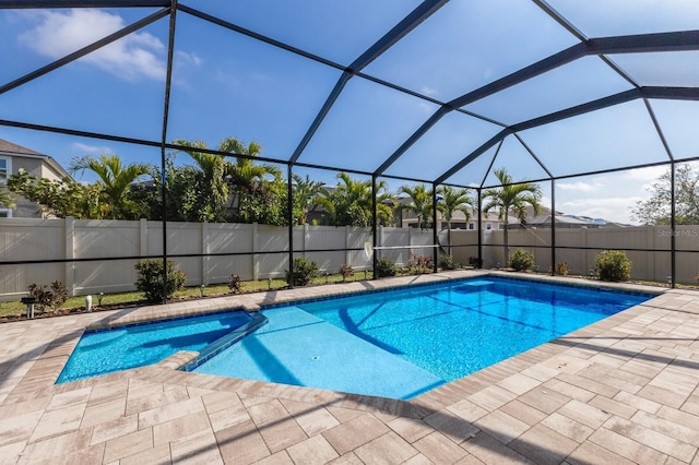 view of pool with a lanai and a patio