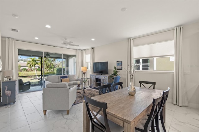 dining room featuring ceiling fan