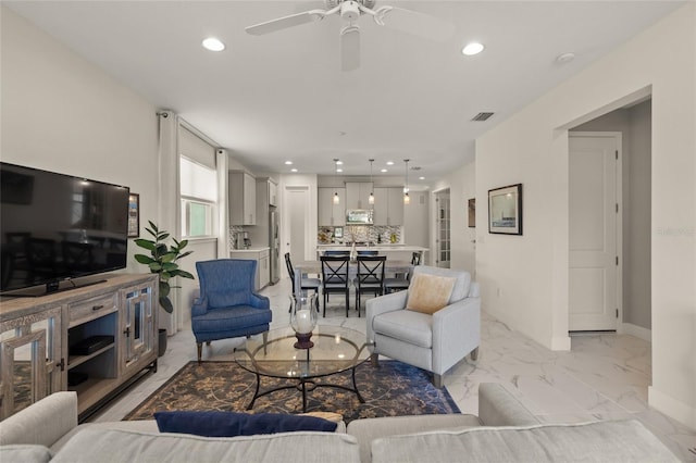 living room with ceiling fan