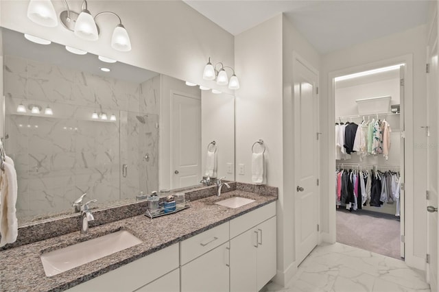 bathroom featuring vanity and an enclosed shower