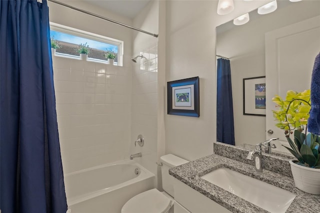 full bathroom featuring vanity, toilet, and shower / tub combo