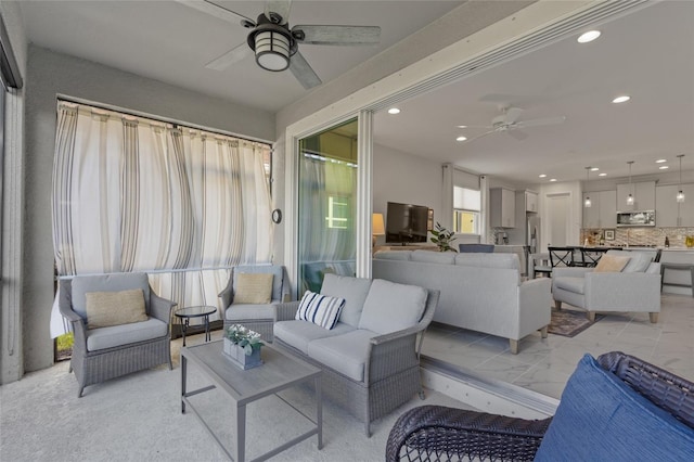 living room featuring ceiling fan