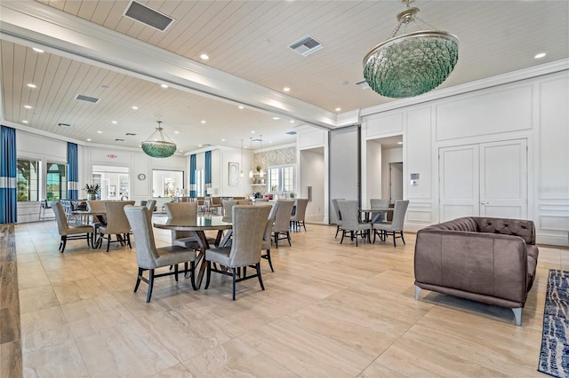 dining space featuring wood ceiling, plenty of natural light, and ornamental molding