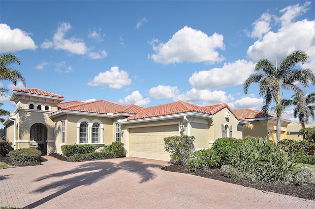 mediterranean / spanish-style home featuring a garage