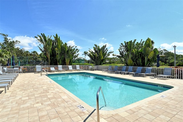 view of swimming pool with a patio area