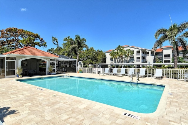 view of pool featuring a lanai and a patio