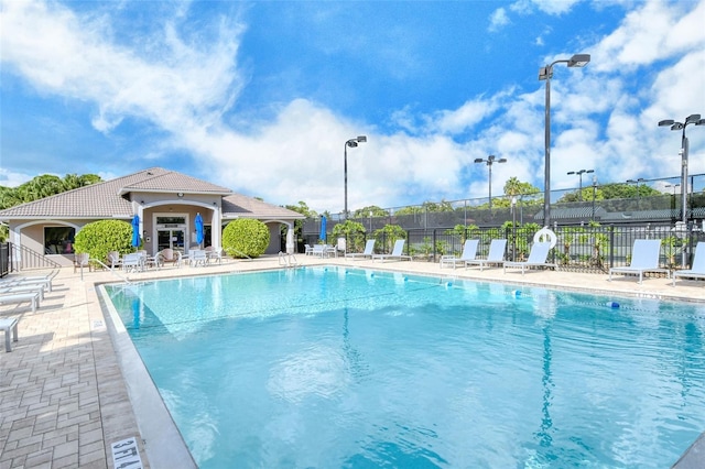 view of swimming pool with a patio area