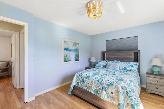 bedroom with light hardwood / wood-style floors