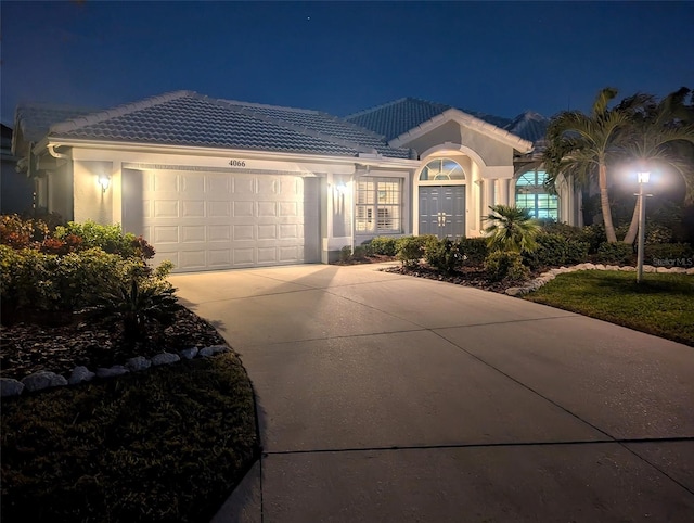 single story home featuring a garage