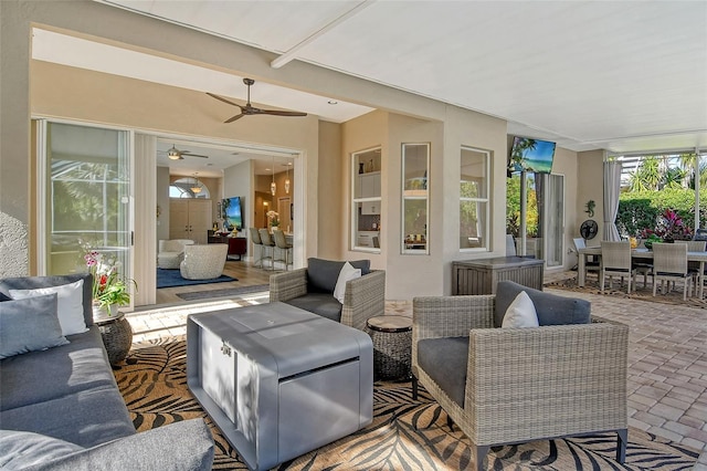 view of patio with an outdoor hangout area and ceiling fan