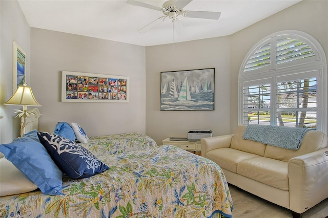 bedroom with ceiling fan and light hardwood / wood-style flooring