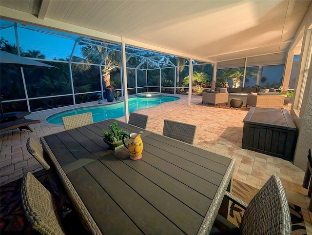 view of swimming pool featuring a lanai, an outdoor hangout area, and a patio area