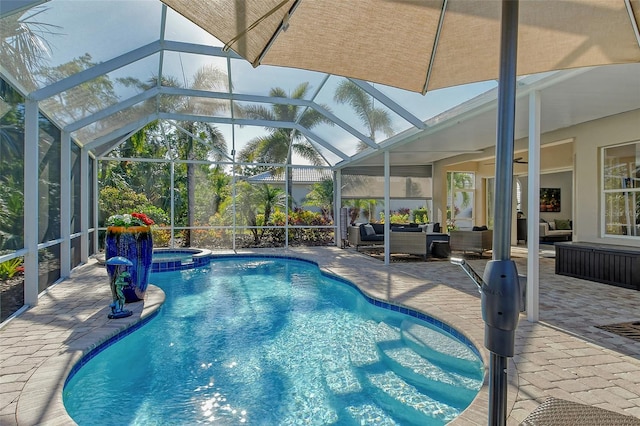 view of pool featuring a patio, a lanai, an outdoor hangout area, and an in ground hot tub