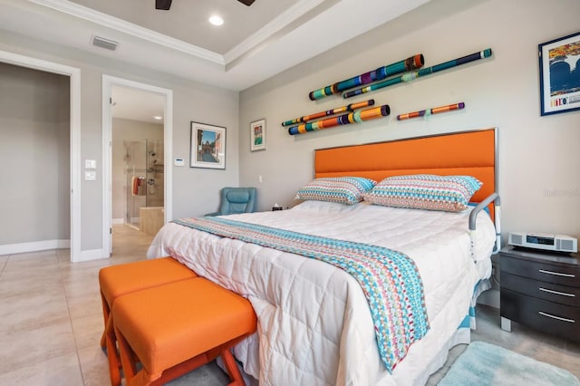 tiled bedroom with ceiling fan, ensuite bath, ornamental molding, and a tray ceiling