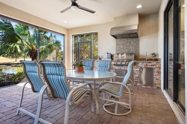 view of patio featuring an outdoor kitchen and ceiling fan