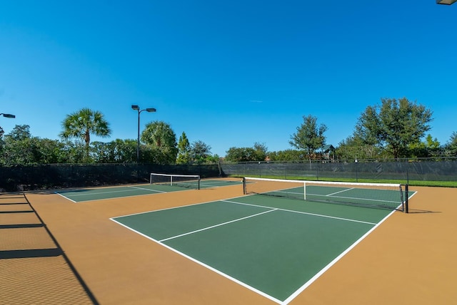 view of tennis court with basketball court