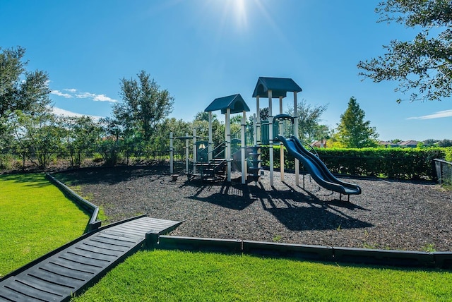 view of playground with a yard