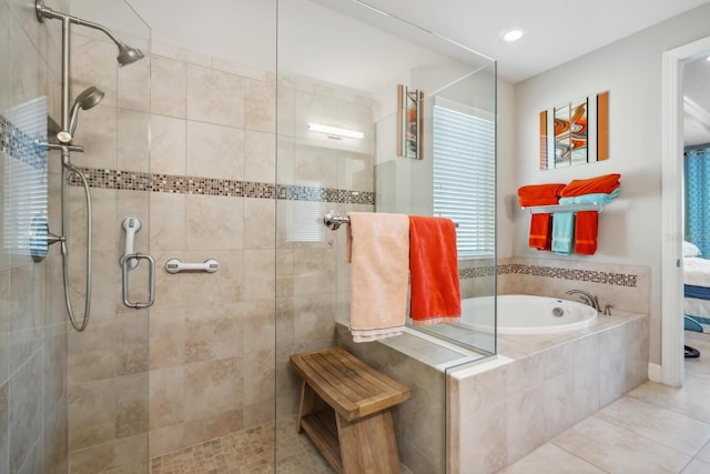 full bath featuring a stall shower, tile patterned flooring, and a garden tub