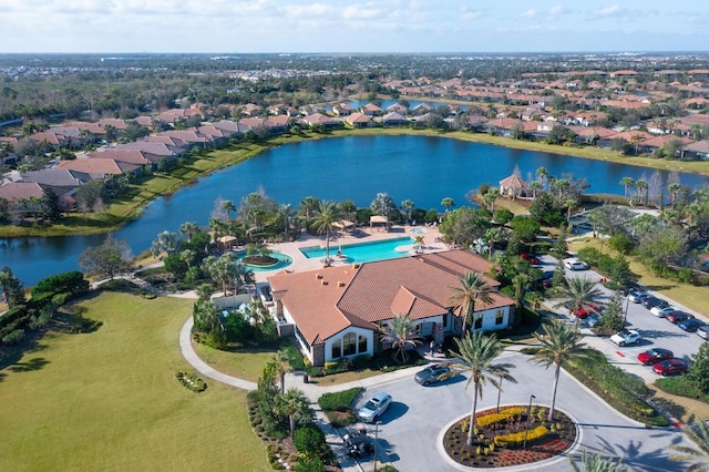 bird's eye view featuring a water view and a residential view