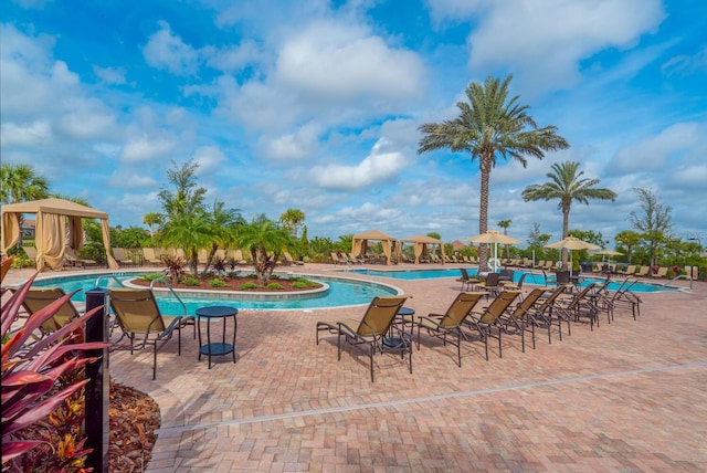 community pool with a gazebo