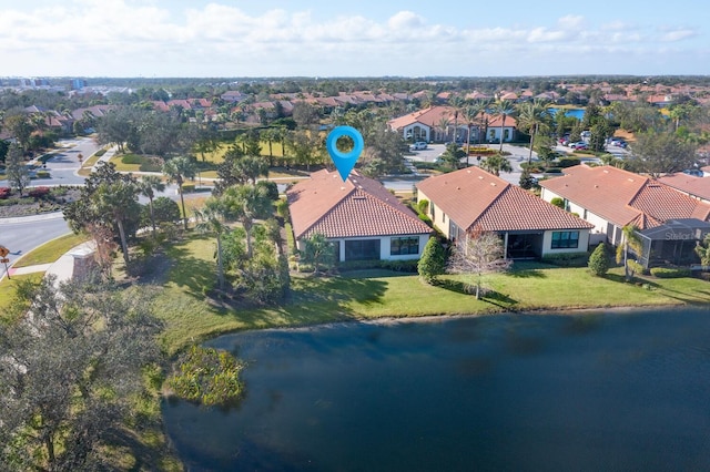 bird's eye view with a residential view and a water view