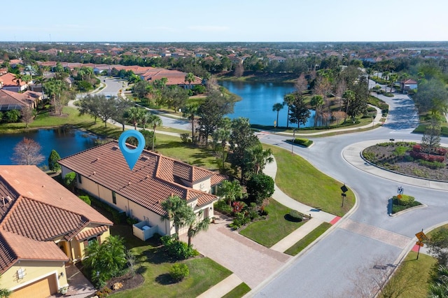 bird's eye view featuring a water view and a residential view