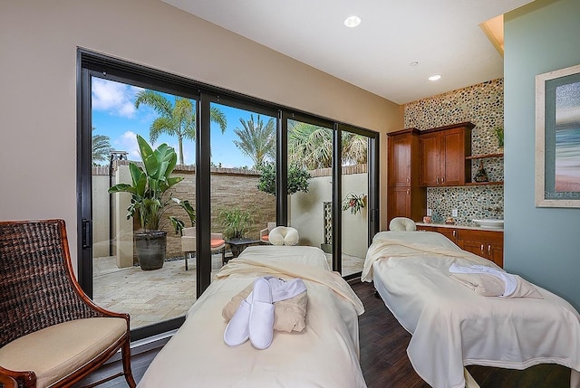 bedroom featuring wood finished floors and recessed lighting