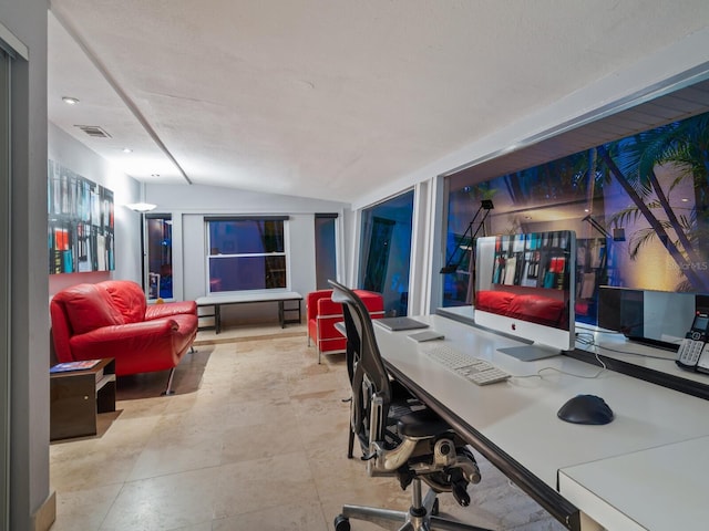 home office featuring vaulted ceiling and visible vents