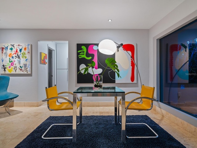 interior space featuring recessed lighting, baseboards, and tile patterned floors