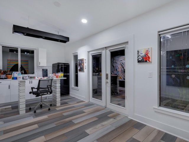 office area with recessed lighting, french doors, baseboards, and light wood finished floors