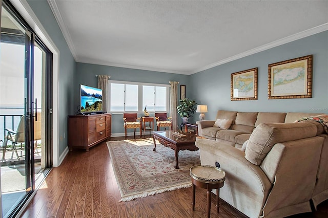 living area featuring dark wood-style floors, baseboards, and crown molding