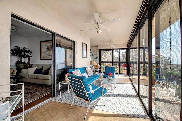 sunroom / solarium with a ceiling fan