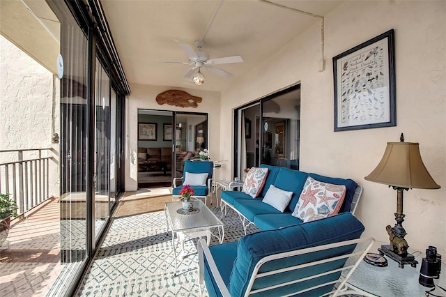 sunroom with a ceiling fan