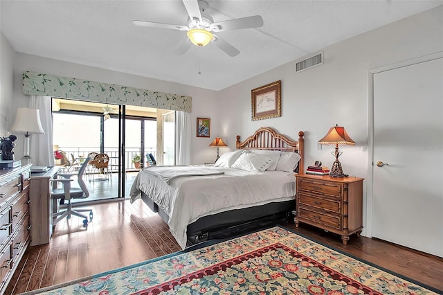 bedroom with access to exterior, ceiling fan, visible vents, and hardwood / wood-style floors