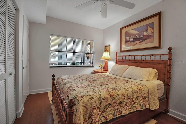 bedroom featuring a closet, baseboards, and wood finished floors