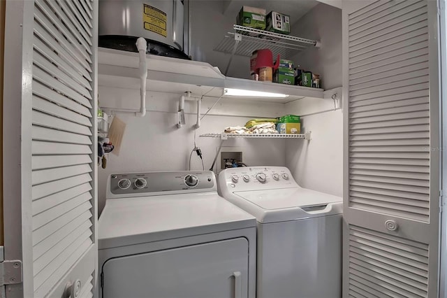 laundry room with laundry area and washer and clothes dryer