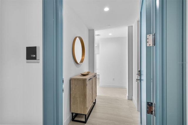 hall featuring recessed lighting, visible vents, and baseboards