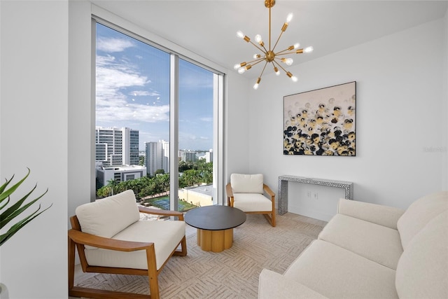 sitting room featuring a chandelier, a view of city, and expansive windows