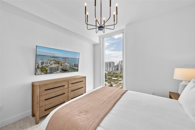 bedroom featuring light carpet and baseboards