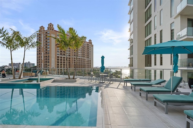 community pool featuring a patio area