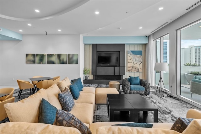 living area with recessed lighting and visible vents