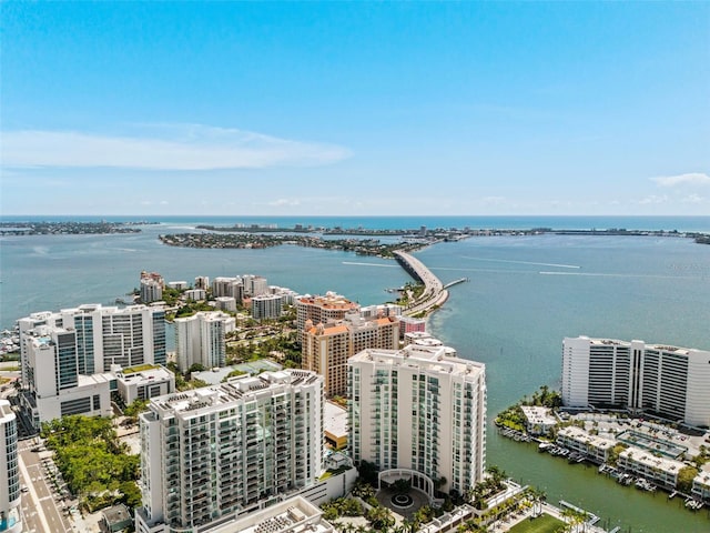 birds eye view of property featuring a view of city and a water view