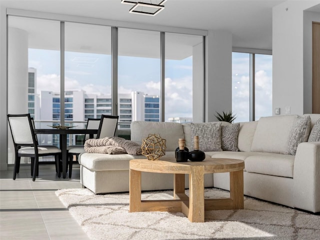 tiled living area featuring a view of city and floor to ceiling windows