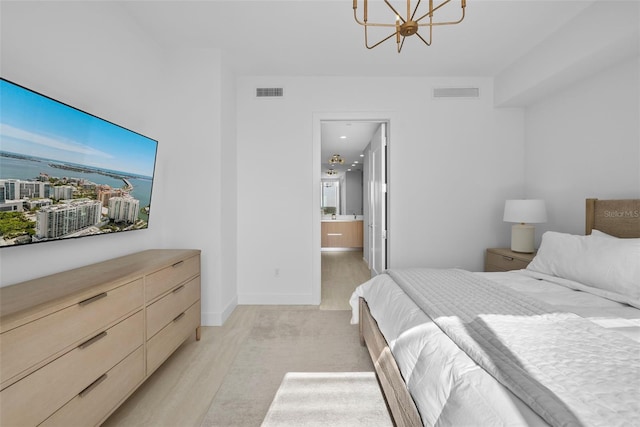 bedroom with an inviting chandelier, light wood-style flooring, multiple windows, and visible vents