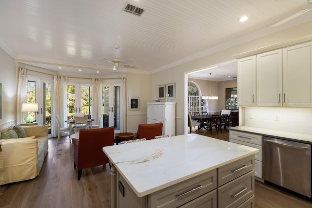 kitchen featuring visible vents, open floor plan, ornamental molding, stainless steel dishwasher, and dark wood-style floors